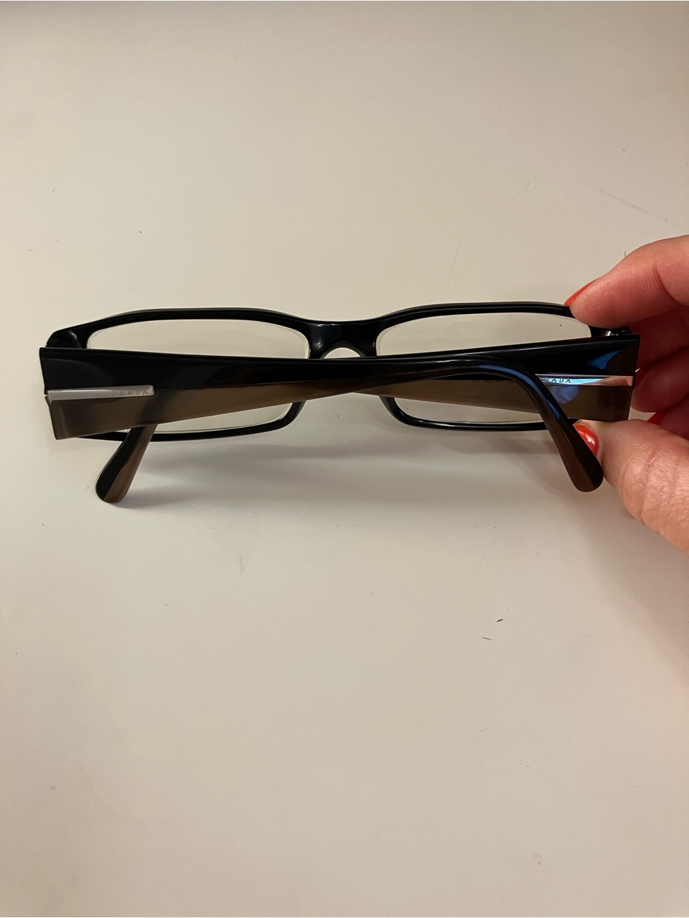Two-tone black/brown rectangular Prada eyeglass frames, model VPR 16H